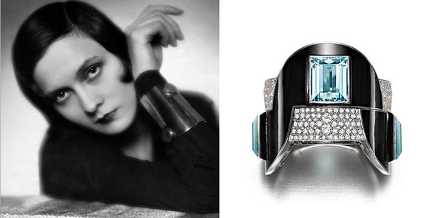 ستاره فیلم فرانسوی Arletty توسط ژان فوکه با یک آکوامارین، الماس، میناکاری طلای سفید و دکمه هنر تزئینی پلاتین ساخته شده توسط طراح از کلکسیون Siegelson ژست گرفت